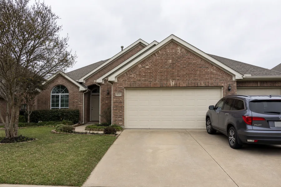 A house with an attached garage in Lewisville, TX